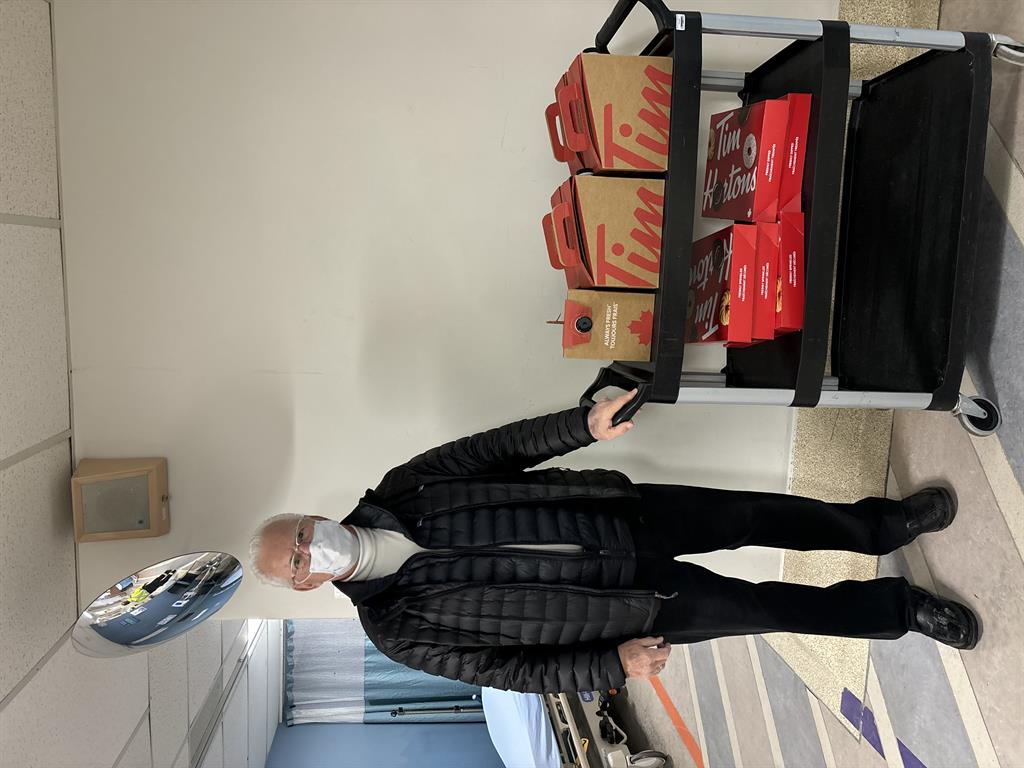 Photo of Ron Willett delivering coffee and donuts to the SMH emergency department